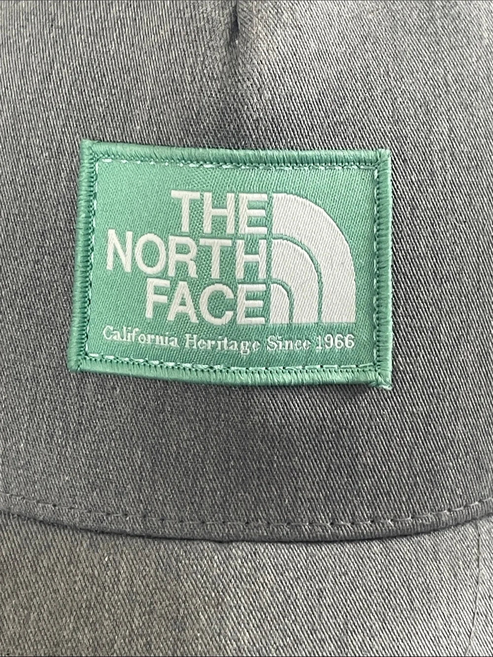 The North Face Gray Trucker Hat with Green Patch!  Excellent Condition Worn once